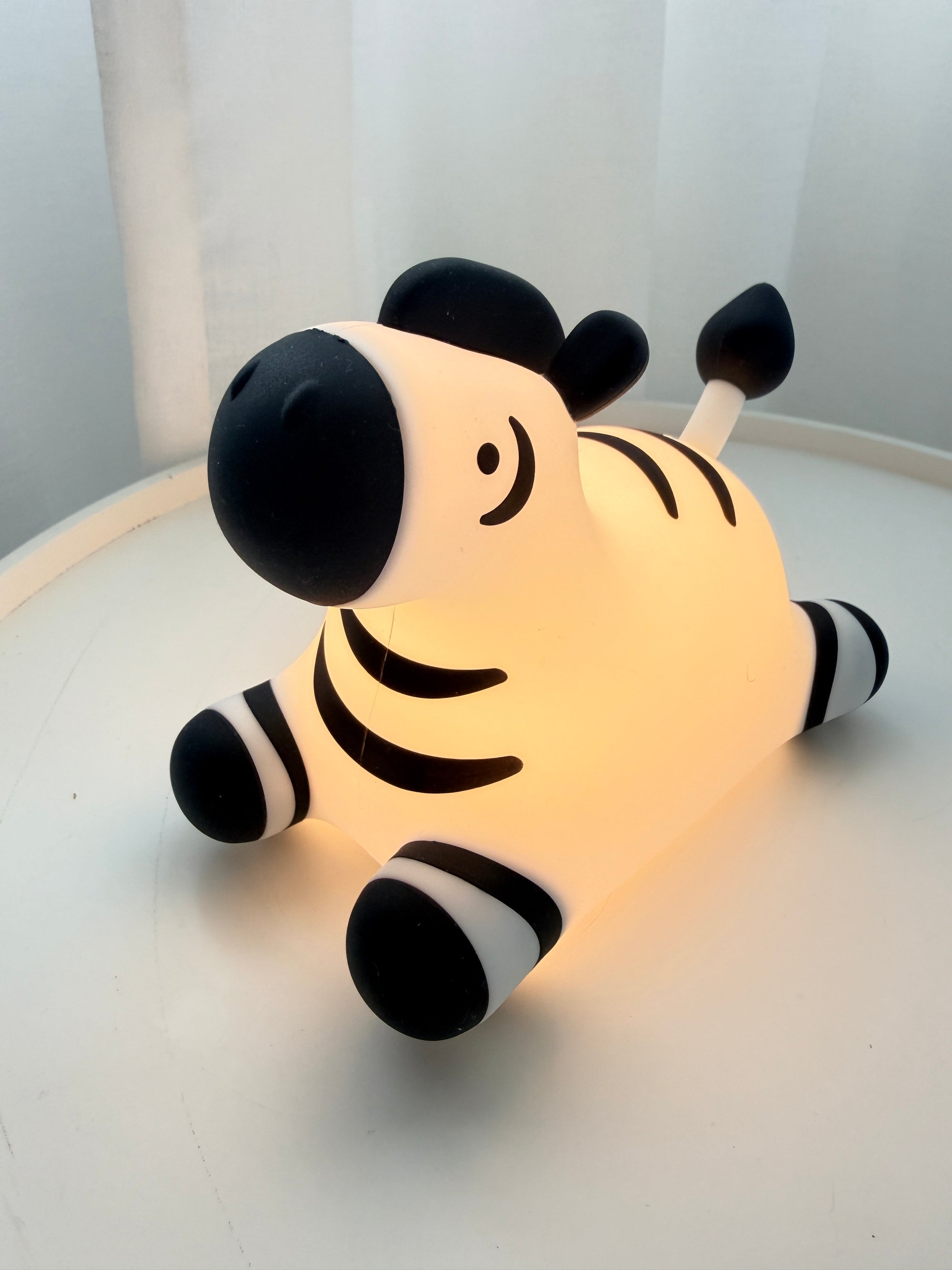 Zebra comfort night light by GlowKind – soft amber glow for children's bedroom